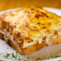 Croque Monsieur · Sandwich bread, bechamel sauce, pork ham, butter and French cheese browned.