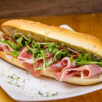Prosciutto Sandwich · Prosciutto, confit tomatoes, basil pesto, provolone cheese, arugula, extra virgin oil and ba...