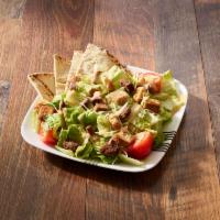 Caesar Salad · Crisp romaine tossed with croutons, Caesar dressing, and grated cheese.
