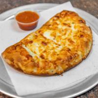 Philly Steak Calzone · Shaved steak, onions, peppers, and mushrooms.
