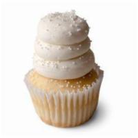 Wedding Cake Cupcake · White cake with vanilla buttercream frosting sprinkled with white non-pareils.