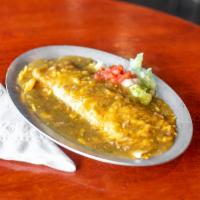 Smothered Beef & Bean Burrito · ground beef and beans wrapped in a flour tortilla, smothered in  green chili, topped with le...