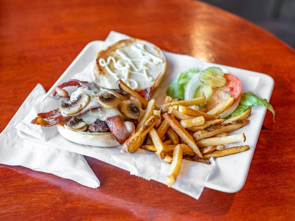 Bacon Swiss Mushroom Burger · Bacon, cheese, pickles, lettuce, onions, and fries.