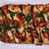 Margherita Flatbread · Olive Oil, Mozzarella Cheese Blend, and Grape Tomato, Topped with Fresh Basil and Balsamic R...