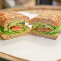 Vegetarian Sandwich · Any bread, avocado, provolone cheese, lettuce, cheese, tomato, red onions, pickles and olives.