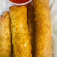 Pork Egg Rolls · Fried and served with sweet chile sauce.