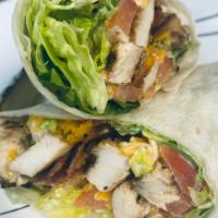 Chicken Bacon Ranch Wrap · Grilled chicken, bacon, cheddar cheese, lettuce, tomato, and ranch dressing wrapped in a tor...