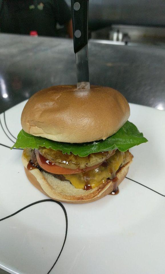 Angus Cheeseburger · Burger cooked to order, topped with your choice of cheese and served on toasted brioche bun. Lettuce, tomato, onion and pickle served on the side.