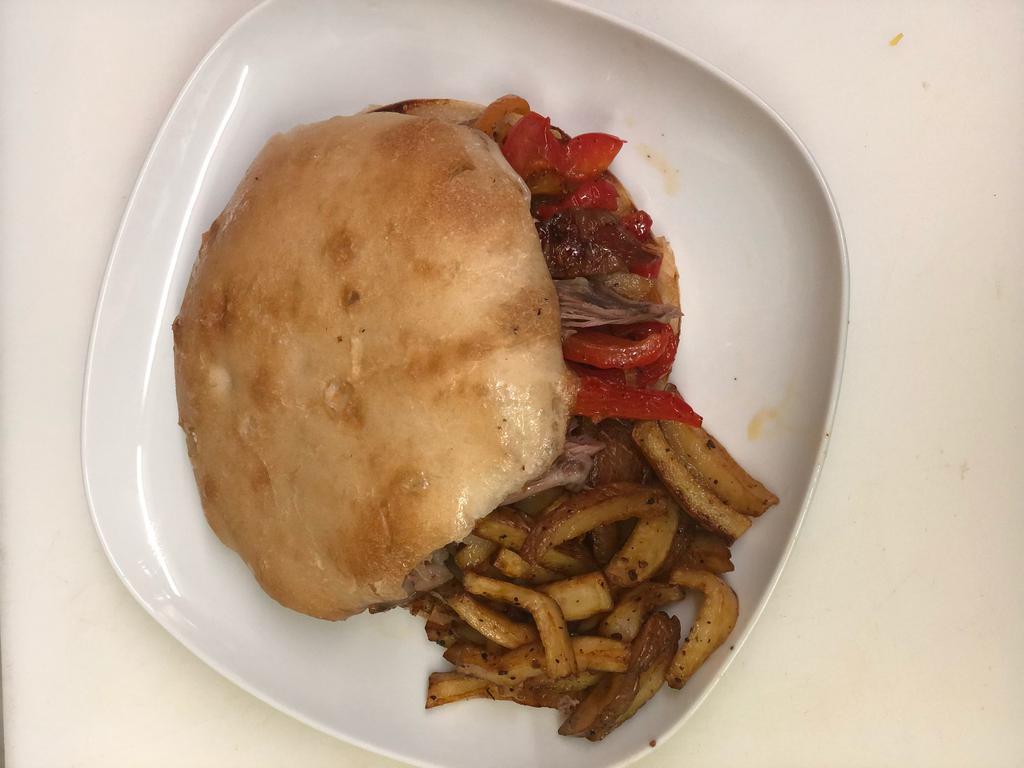  Lamb Philly Cheese Sandwich · Savory Lamb Sandwich that comes with Balkan style pita bread and roasted potatoes.