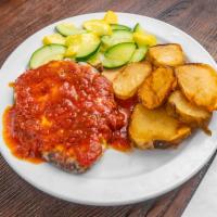 Chicken Parmesan · Tender cutlet, tomato sauce, mozzarella cheese, sauteed vegetables, and baked potato.