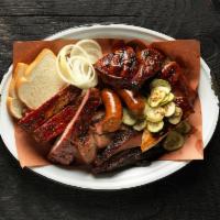 Pitmaster Combo · 1/4 piece of chicken, 1 pork rib, 1/4 lb. brisket, 1 sausage, and choice of two 6oz sides.