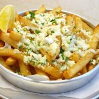 Greek French Fries · Seasoned French fries with feta cheese and olive oil.