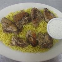 Chicken on Rice · Marinated, grilled chicken tenderloin atop a bed of our unique rice: a mixture of rice with ...