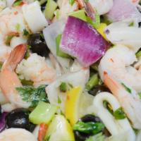 Seafood Salad · Shrimp, calamari, crab meat over mixed greens with olives, onions, celery, tomato, avocado a...