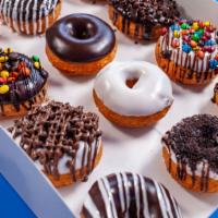 Chocolate Lovers Half Dozen Assortment · Chocolate Lovers choice! Includes: 3 Chocolate & 3 Vanilla icing doughnuts of our favorite c...
