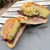 Big Belly Cubano (1) · Maple bourbon ham, jowl bacon, pickles, emmenthaler and dijon on a brioche roll