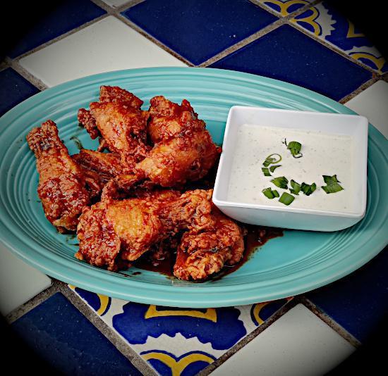 Juan's Wings · Charred Jerk, Buffalo or spicy coconut sauce. Served with blue cheese dressing.