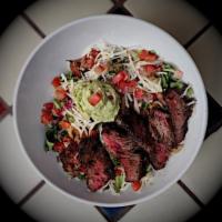 Fajita Salad · Grilled chicken or steak atop a blend of lettuce, refried beans, salsa fresca, guacamole, sh...