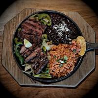 Grilled Steak · You'll hear it coming. Served on a sizzling platter, accompanied with our specially spiced, ...