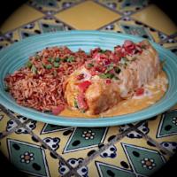 Steak Chimichanga · Seasoned chunks of sirloin and refried beans rolled in a flour tortilla, lightly fried, bake...