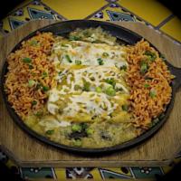 Skillet Baked Enchiladas · 3 cheese enchiladas with chicken, sirloin, and ground beef baked in tomatillo sauce on a hot...