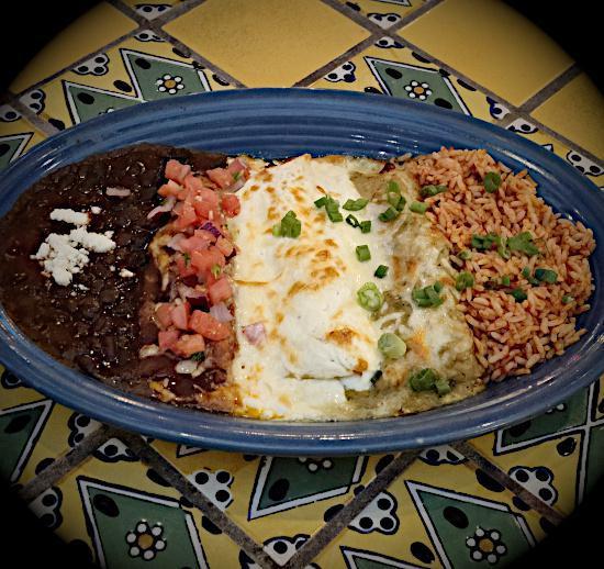 Enchiladas Banderas · 3 enchiladas filled with cheese, guacamole, black beans, and salsa fresca. Baked in red, white, and green sauces. Served with Mexican rice and beans. Vegetarian.