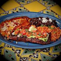 Carne Asada · Grilled seasoned steak topped with hacienda sauce and salsa fresca. Served with Mexican rice...