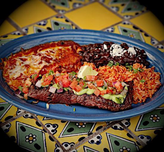 Carne Asada · Grilled seasoned steak topped with hacienda sauce and salsa fresca. Served with Mexican rice, beans, and a cheese enchilada.