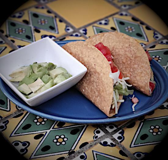 Kids Taco · Chicken or ground beef, lettuce, cheese, and tomato.