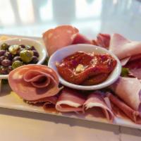 ROCCO'S IMPORTED ANTIPASTO · Our Executive Chefs Imported Selection Of Meats & Cheeses From Italy.