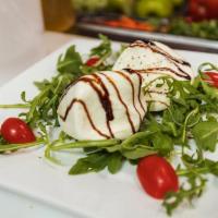 HOMEMADE BURRATA · Served With Cherry Tomatoes, Arugula, And Balsamic Reduction.