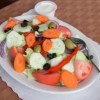 Fresh Tossed Salad · Iceberg lettuce, plum tomatoes, carrots, black, and green olives, peppers, cucumbers, and It...