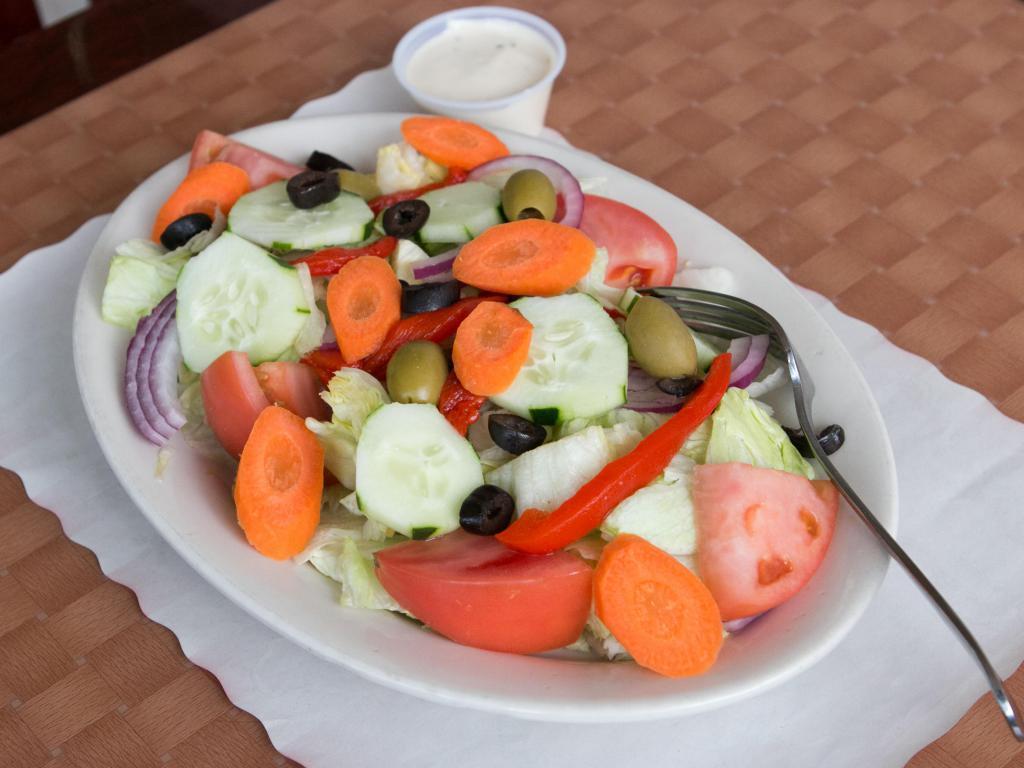 Fresh Tossed Salad · Iceberg lettuce, plum tomatoes, carrots, black, and green olives, peppers, cucumbers, and Italian dressing.