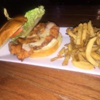 Spicy Chicken Sandwich · Crispy chicken breast, marinated in Sriracha seasoning topped with bacon, pepper jack cheese...