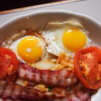 Irish Breakfast · Two eggs any style with Irish bacon, sausage, black and white pudding, fried tomatoes. Serve...