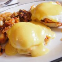 Norwegian Style Eggs Benedict · Two poached eggs on an English muffin with lox and topped with hollandaise sauce. Served wit...