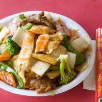Happy Family · Chunks of chicken pork, beef and jumbo shrimp with selected vegetable in ghanghia style. Ser...