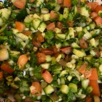 Moroccan Salad · Cucumber, tomatoes, parsley, cilantro, green onions, olive oil, lemon juice, herbs.