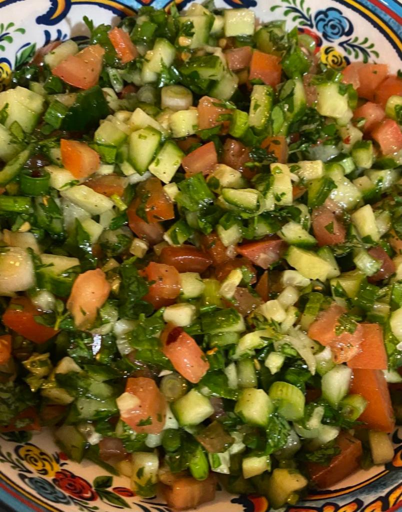 Moroccan Salad · Cucumber, tomatoes, parsley, cilantro, green onions, olive oil, lemon juice, herbs.