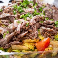 Beef and Lamb Shawarma Platter · Roasted Beef and lamb shawarma with the choice of three sides