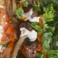 Beef skewers sandwich  · Grilled top sirloin skewers
Salad ( tomatoes, fresh basil, garlic, oregano, black pepper and...