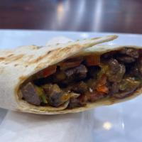 Beef and Lamb Shawarma Sandwich · Beef and lamb shawarma , lettuce, tomatoes, onions, white cabbage, pickles.