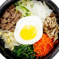 Dol-Sot-Bibimbap · Rice topped with vegetables and a choice of beef, chicken, or tofu with a fried egg. Sunnysi...
