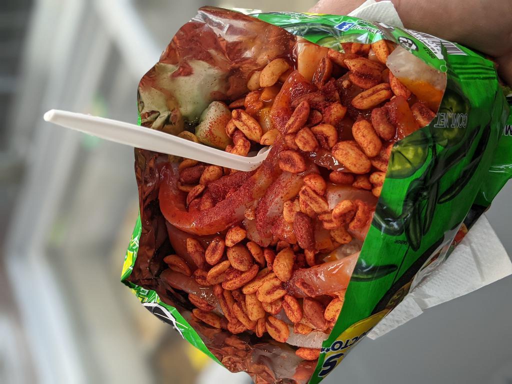 Tostilocos · Tostitos, takis, doritos, or hot cheetos with jicama, cucumber, pickled pork skin, chamoy sauce, valentina hot sauce, lime juice and spicy peanuts