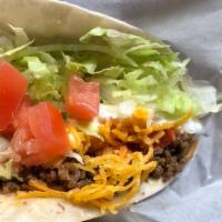 Soft Taco -ground beef · Soft flour tortilla with ground beef, cheddar cheese, mild sauce, lettuce and tomato.