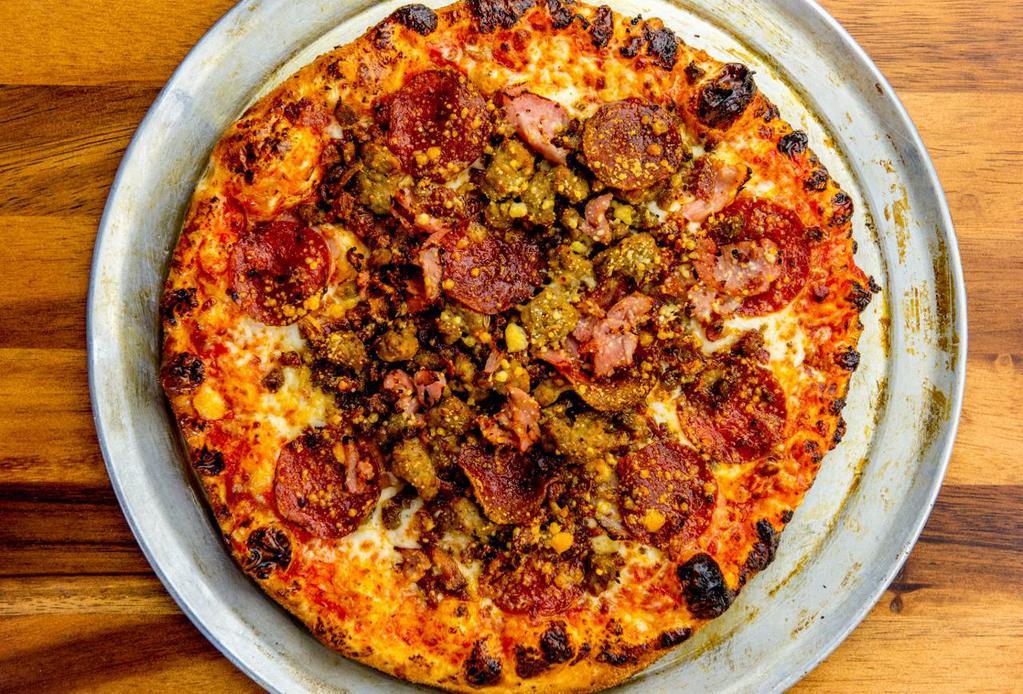 The Beast · Traditional crust with parmesan cheese around the edge, tomato blend, mozzarella, nitrate-free pepperoni, meatball, ham, bacon and pork sausage. (Other than a crust change, no substitutions.)