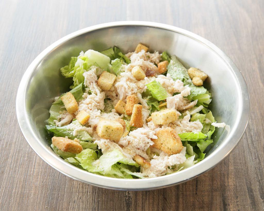 Classic Chicken Caesar · Romaine, pulled chicken breast, parmesan, croutons and Caesar dressing.