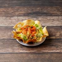 Baja Taco Salad · Baked tortilla shell, beans, lettuce, meat, cheese, and pico de gallo.