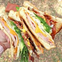 Club Sandwich · Triple decker with ham, turkey, bacon, Swiss, cheddar, lettuce, tomato, red onion, mustard a...