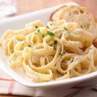 Fettuccine Alfredo · Add Chicken or Shrimp for $1.00 extra. Served with 2 pieces of garlic bread. 